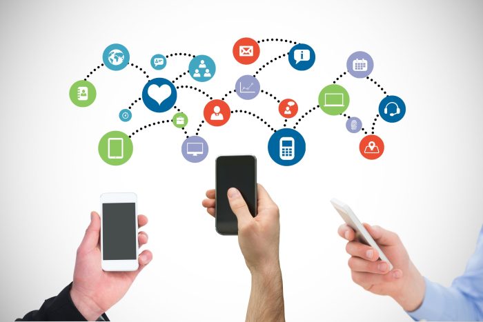 digital composite of hands using smartphones with graphics What is Reach in Social Media